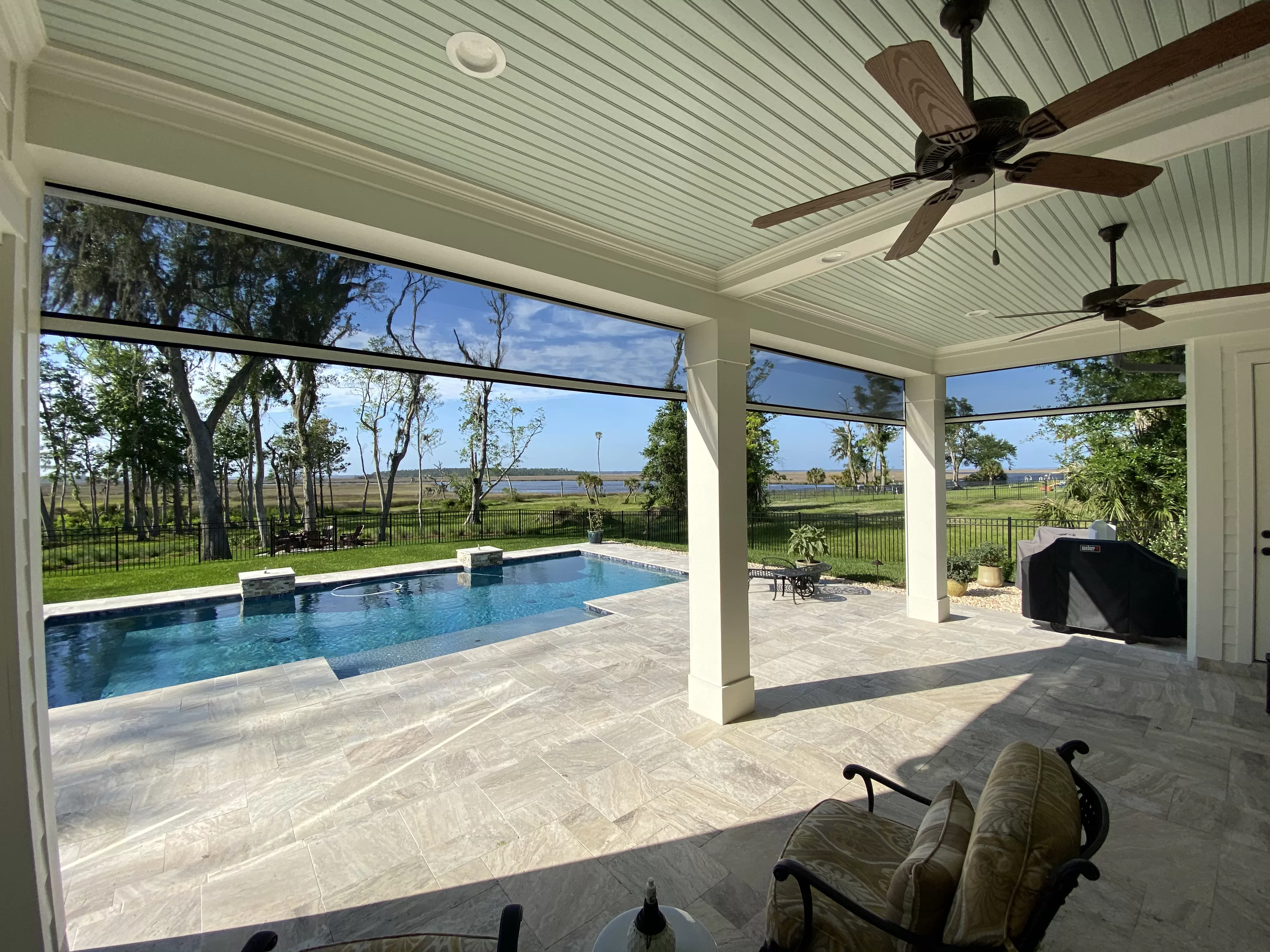 Retractable screens are the perfect addition to this patio.