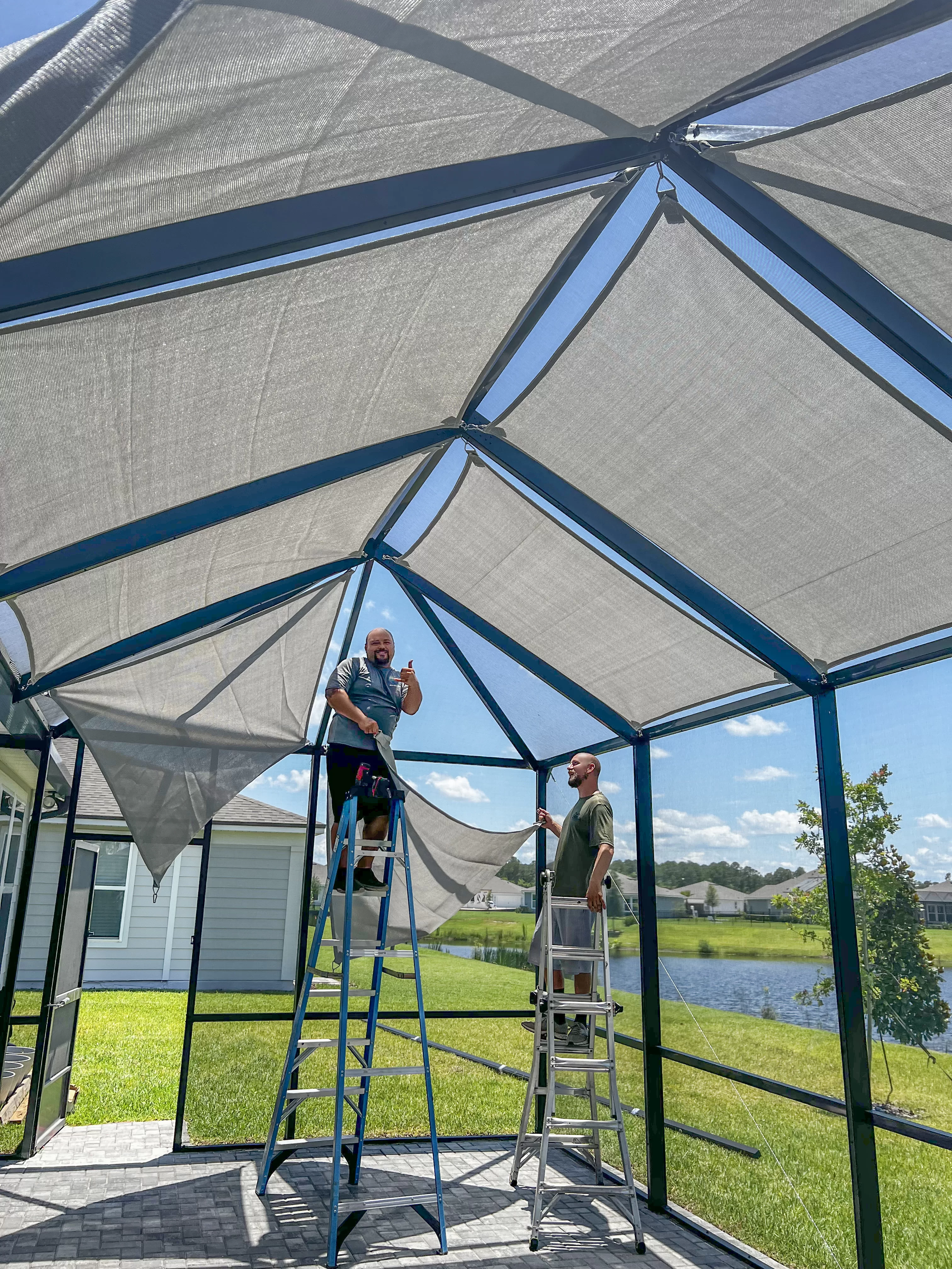 Screen Enclosures and More’s friendly team of professionals install shade sails for a homeowner on their screen enclosure.