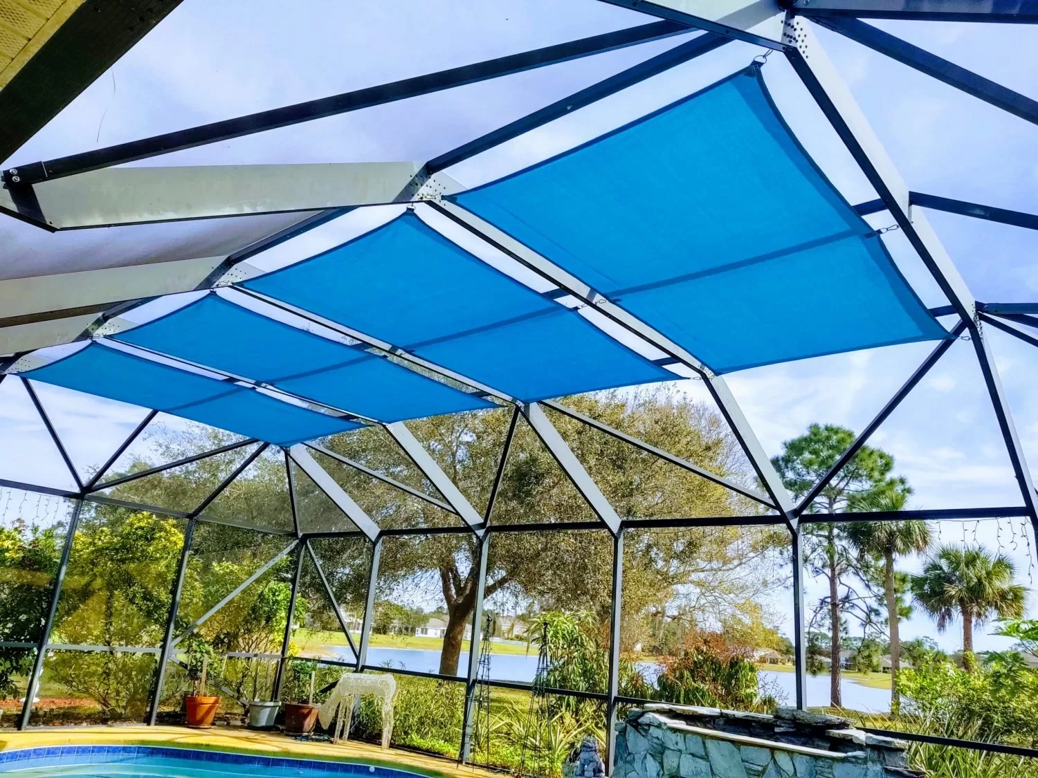 These bright blue shade sails add color and create a fun environment in the backyard.