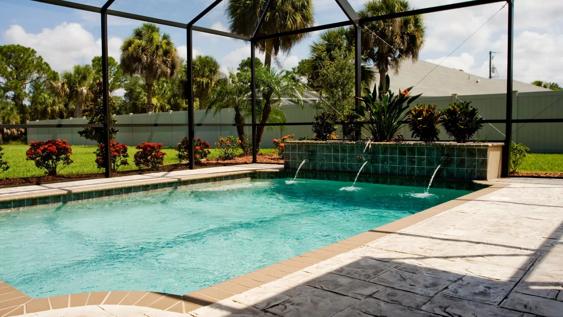A beautiful pool enclosure covers a Florida pool. 