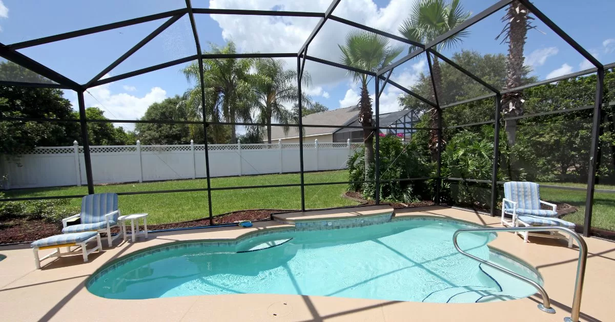 A beautiful pool enclosure keeps this pool free from fall dirt and debris.