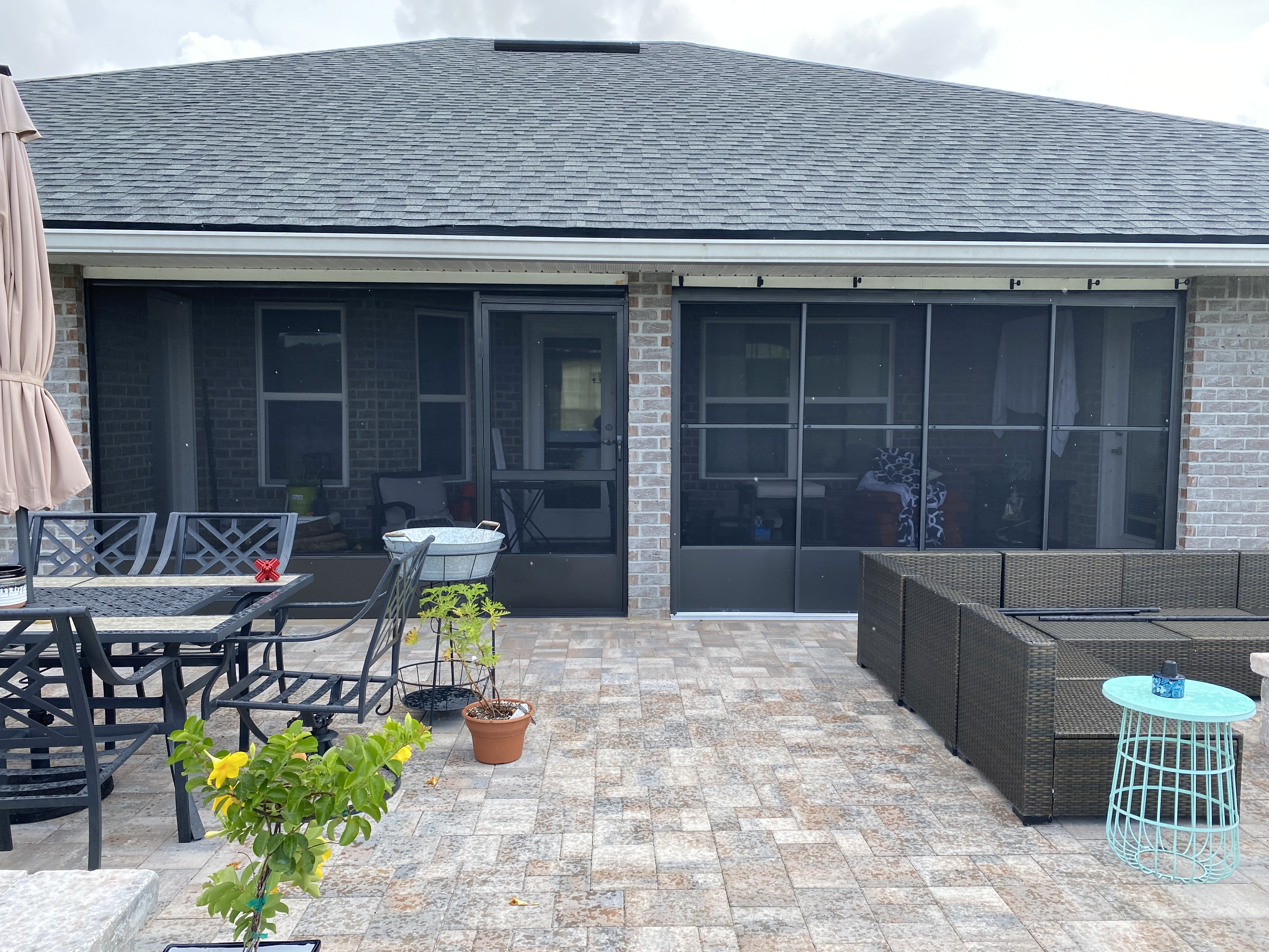 A patio screen enclosure room is ready for summertime fun!