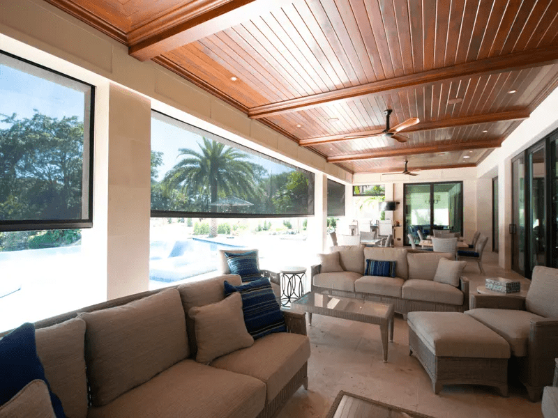 This lanai is full of patio furniture that doesn’t have to be brought inside because of a hurricane of storm because the homeowner has Fenetex hurricane screens.